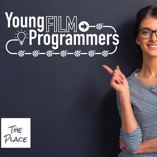 woman points to Young Film Programmers logo on a blackboard. Logo of the place appears bottom left.