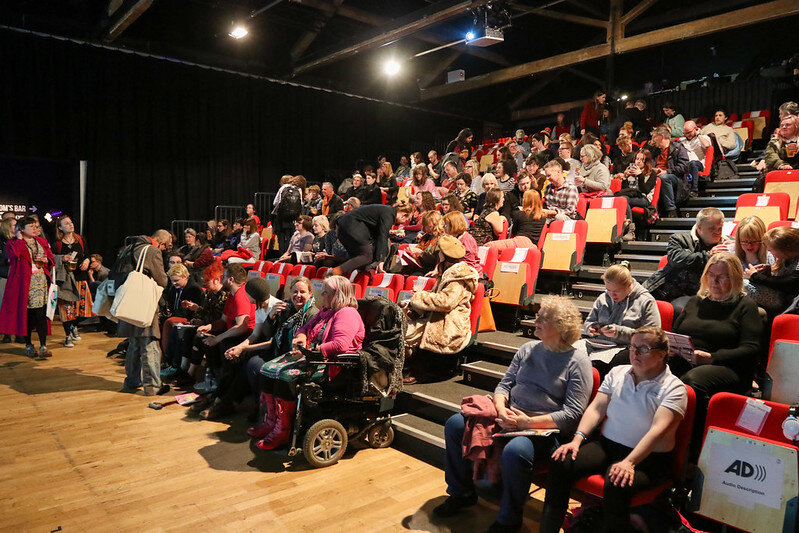A full cinema audience of people at Oska Bright Film Festival.
